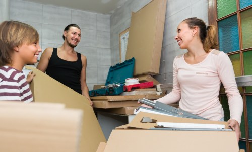 Professional movers handling office equipment during relocation