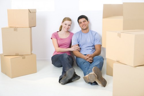 Professional movers handling furniture in Maidavale