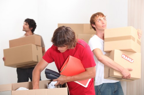 Removalist packing fragile items securely